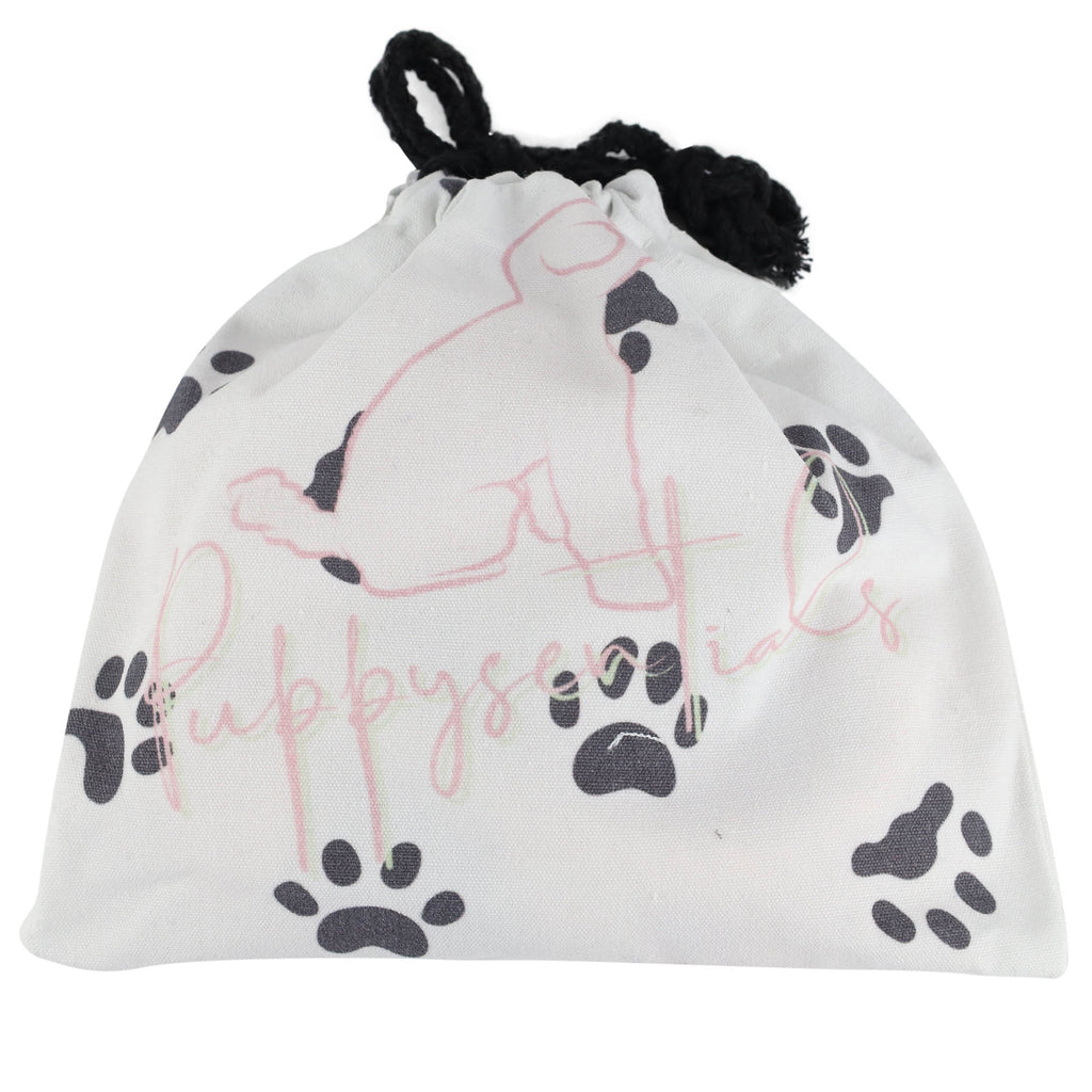 White cotton Puppysentials drawstring gift bag with paw print design, included with every handmade rope dog leash for easy storage, washing or gifting.
