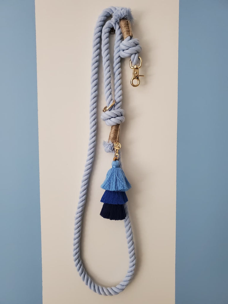 Full length light blue cotton rope dog leash hanging vertically showing handle and clasp. Soft and strong rope leash for dogs.