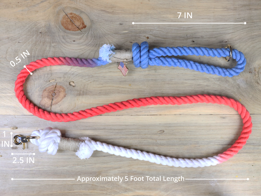 Red white and blue rope dog leash by Puppysentials shown flat with 5 foot length measurement