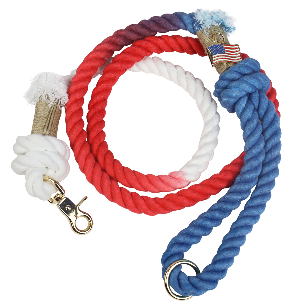 Limited Edition USA rope dog leash in red white and blue with gold hardware and USA flag charm featuring Puppysentials logo.